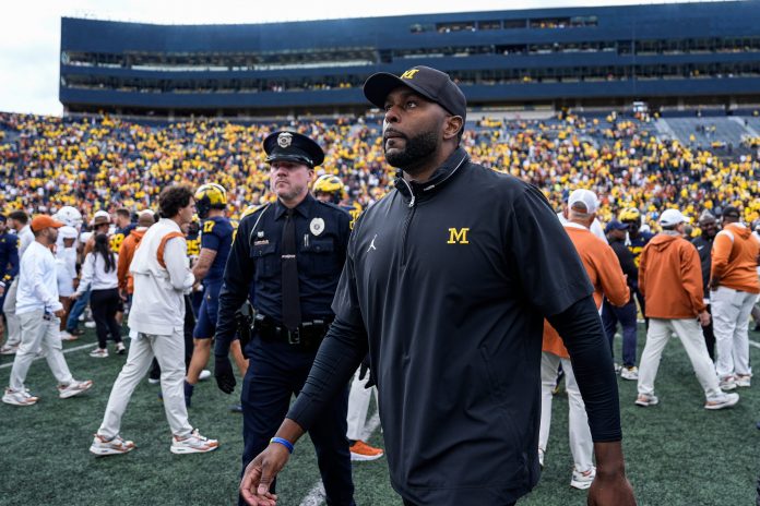 Michigan coach Sherrone Moore walks off the field after his team's 31-12 loss to Texas at Michigan Stadium in Ann Arbor on Saturday, Sept. 7, 2024.