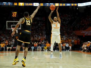 Tennessee's Zakai Zeigler (5) with the 3-point attempt while defended by Missouri's Tony Perkins (12) in an NCAA college basketball game on Wednesday, Feb. 5, 2025, in Knoxville, Tenn.