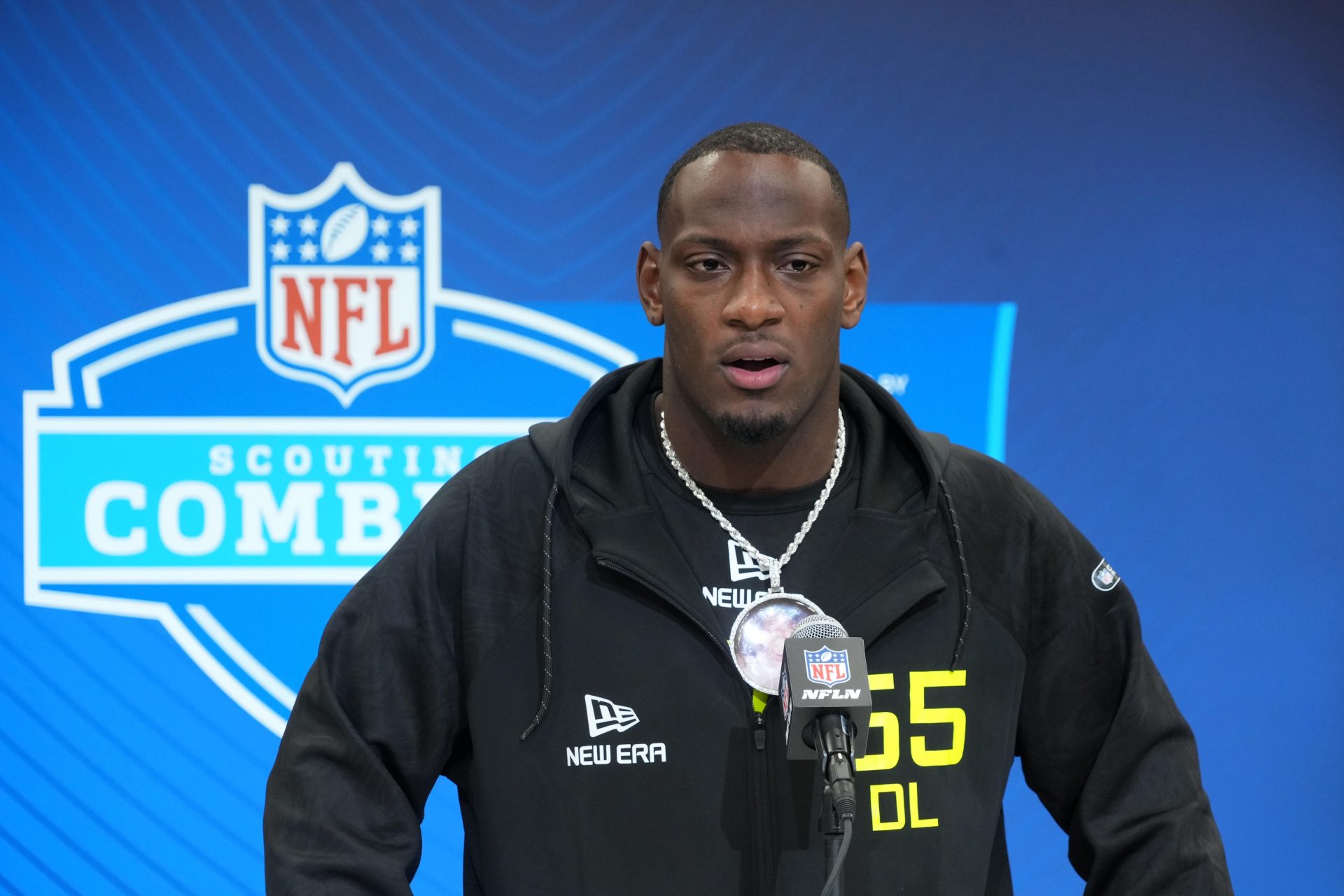Texas A&M defensive lineman Nic Scourton (DL65) wears a medallion with picture of late uncle Harold during the 2025 NFL Scouting Combine at the Indiana Convention Center.
