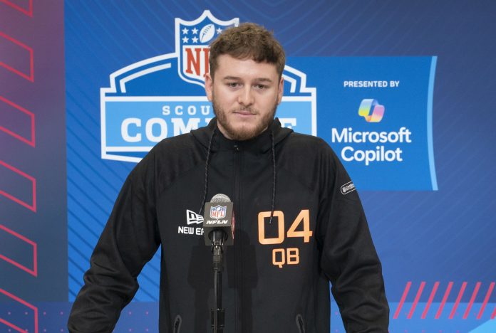 Texas quarterback Quinn Ewers (QB04) answers questions at a press conference during the 2025 NFL Combine at Indiana Convention