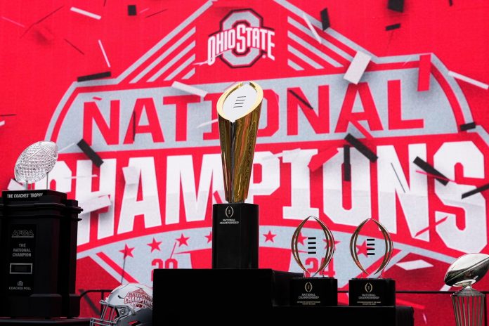 The championship trophies sit on the stage during the Ohio State Buckeyes College Football Playoff National Championship celebration at Ohio Stadium in Columbus on Jan. 26, 2025.