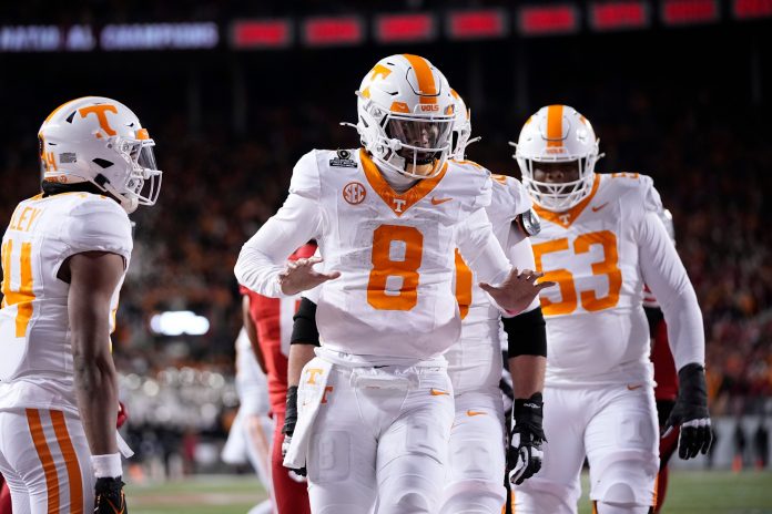 Tennessee Volunteers quarterback Nico Iamaleava (8) celebrates a touchdown during the first half of the College Football Playoff first round game against the Ohio State Buckeyes at Ohio Stadium in Columbus on Dec. 21, 2024.