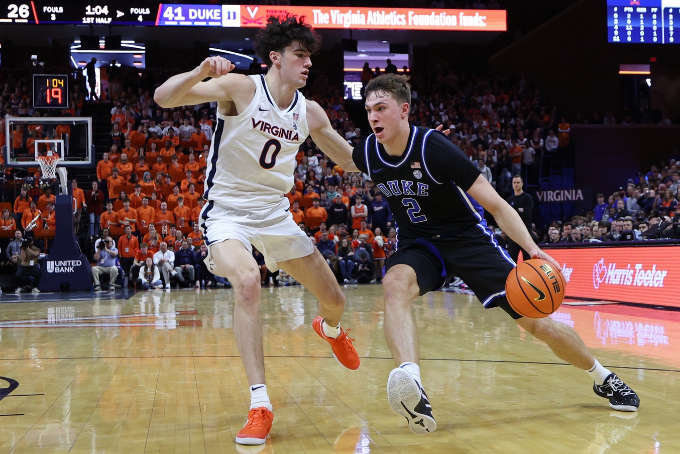 Duke Blue Devils guard Cooper Flagg (2) drives to the basket as Virginia Cavaliers forward Blake Buchanan (0) defends in the first half at John Paul Jones Arena.