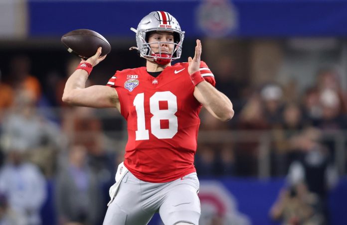 Ohio State Buckeyes quarterback Will Howard (18) throws during the first quarter of the College Football Playoff semifinal against the Texas Longhorns in the Cotton Bowl at AT&T Stadium.