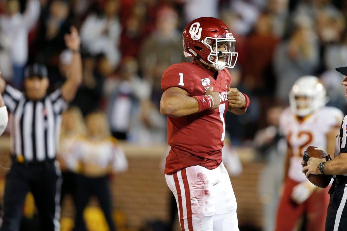 Oklahoma's Jalen Hurts (1) celebrates after scoring a touchdown during an NCAA football game between the University of Oklahoma Sooners (OU) and the Iowa State University Cyclones at Gaylord Family-Oklahoma Memorial Stadium in Norman, Okla., Saturday, Nov. 9, 2019.