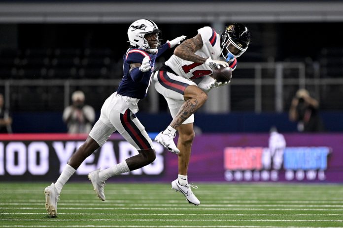 West wide receiver Will Sheppard of Colorado (14) catches a pass in front of East defensive back Zah Frazier of UTSA (0) during the first half at AT&T Stadium.