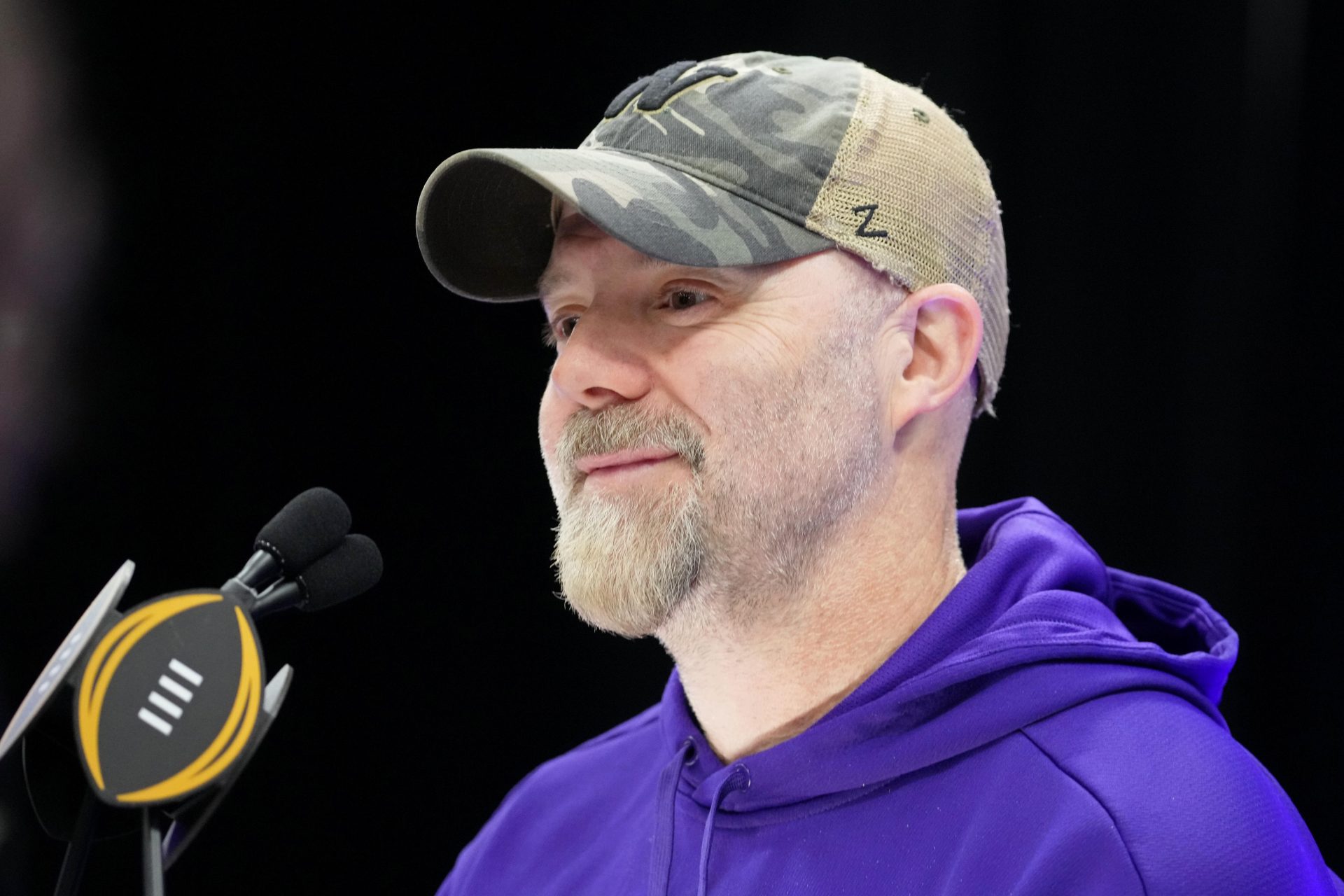 Washington Huskies offensive coordinator Ryan Grubb talks to the media during media day before the College Football Playoff national championship game against the Michigan Wolverines at George R Brown Convention Center.