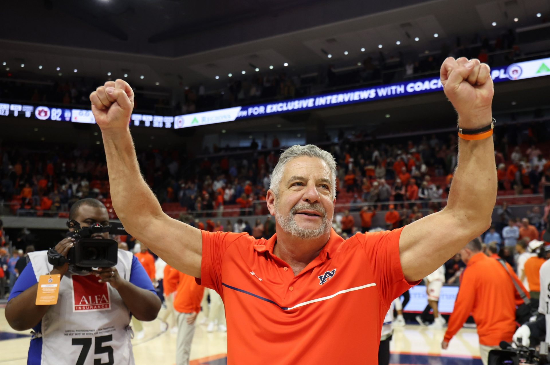 Auburn Tigers head coach Bruce Pearl celebrates the win after the game against the Georgia Bulldogs at Neville Arena.