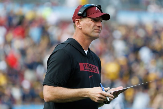 Alabama Crimson Tide head coach Kalen DeBoer looks on against the Michigan Wolverines during the first half at Raymond James Stadium.