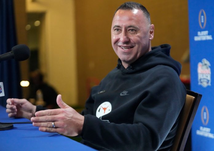 Texas head coach Steve Sarkisian answers questions during media day for the Chick-fil-A Peach Bowl in Atlanta