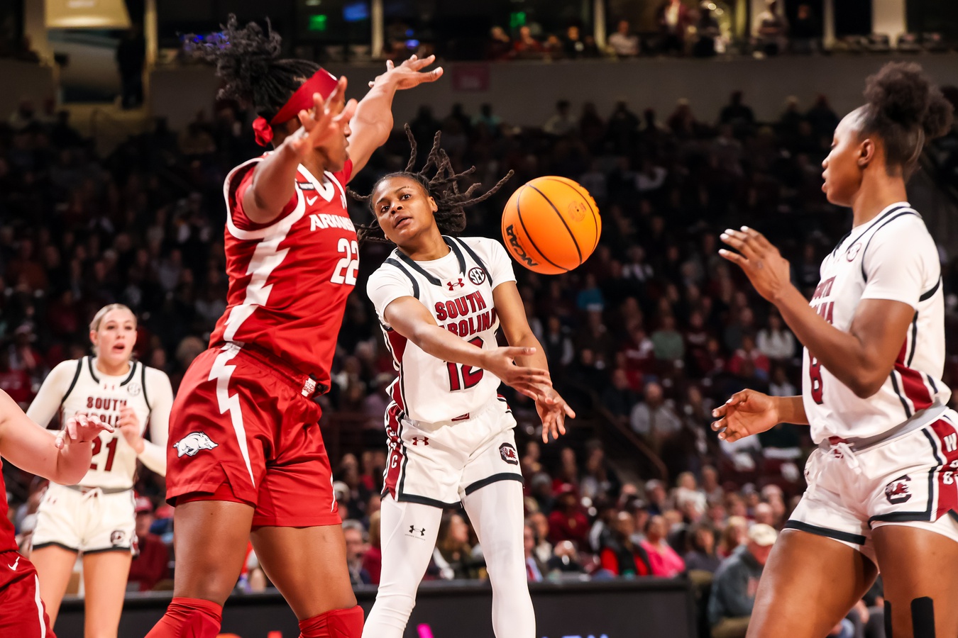 South Carolina Gamecocks guard MiLaysia Fulwiley (12) passes to forward Joyce Edwards (8) around Arkansas Razorbacks forward Vera Ojenuwa (22) in the first half at Colonial Life Arena.