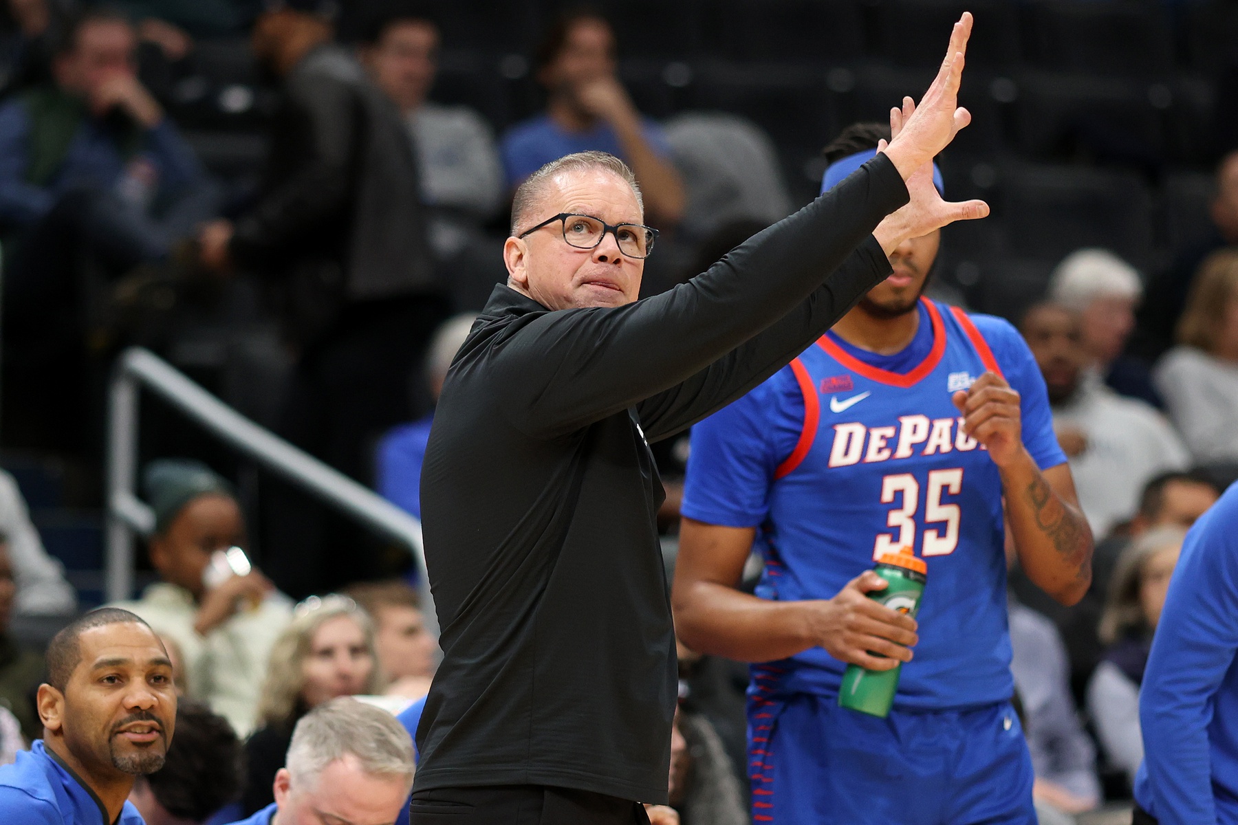 DePaul Blue Demons head coach Chris Holtmann signals to his players during the second half against the Georgetown Hoyas at Capital One Arena.