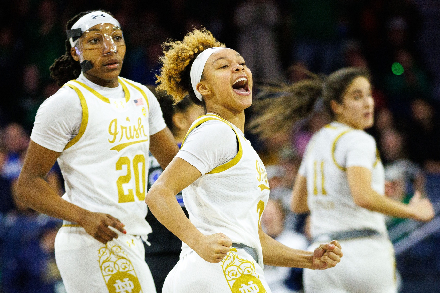 Notre Dame guard Hannah Hidalgo, center, celebrates making a three point shot during a NCAA women's basketball game between No. 1 Notre Dame and No. 11 Duke at Purcell Pavilion.