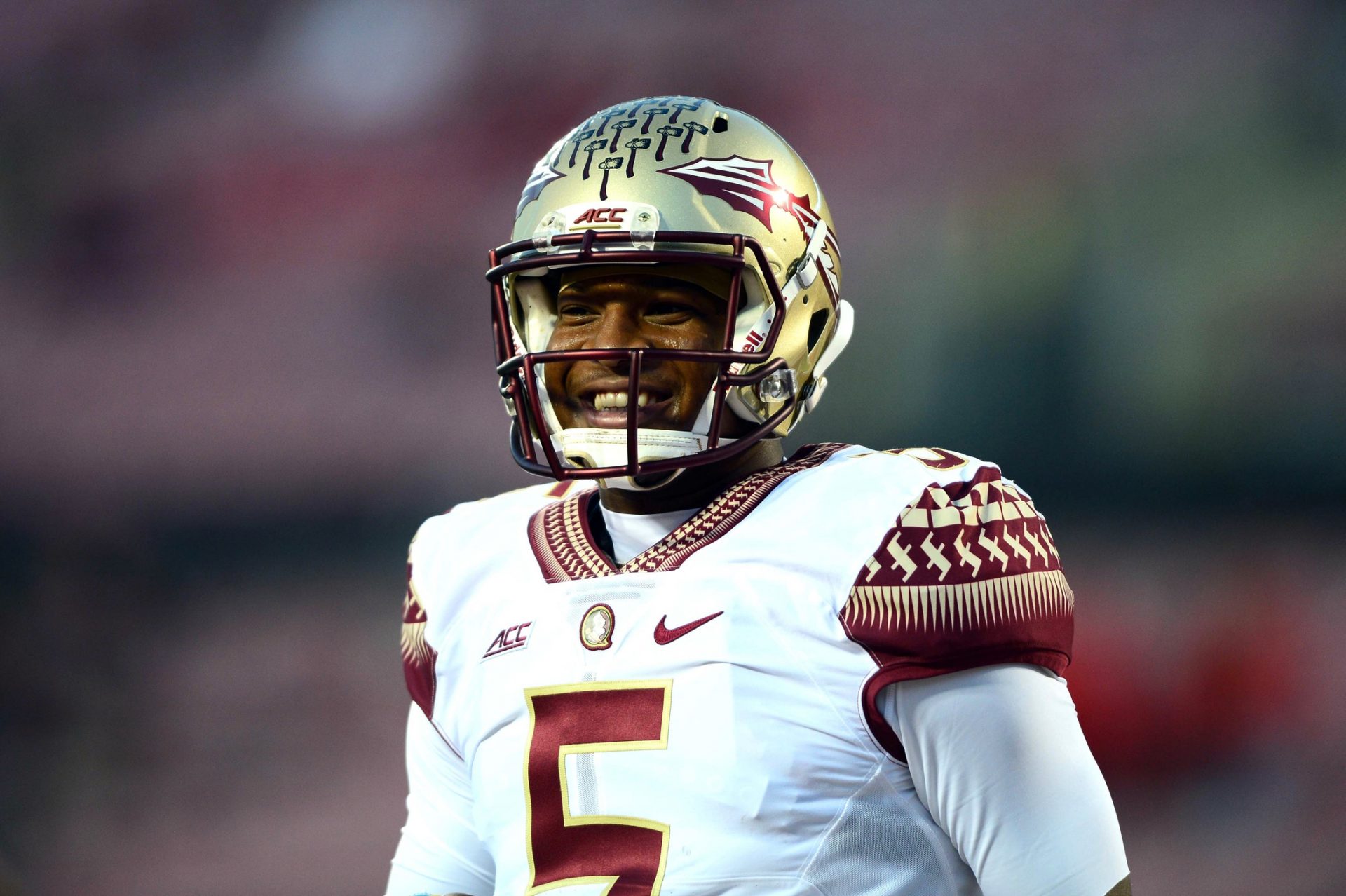 Florida State Seminoles quarterback Jameis Winston (5) warms up prior to the game against the Louisville Cardinals at Papa John's Cardinal Stadium.