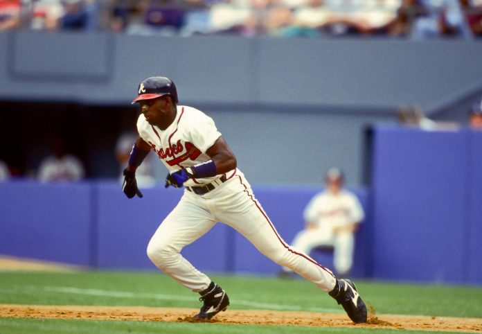 Atlanta Braves outfielder DEION SANDERS in action against the Los Angeles Dodgers at Fulton County Stadium during the 1991 season.