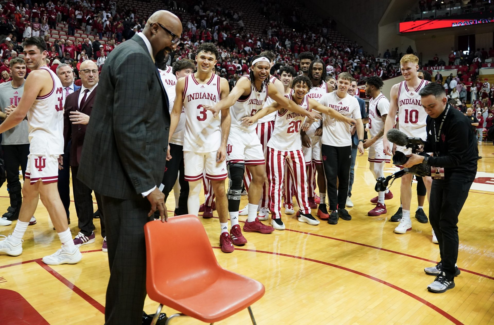 Indiana Hoosiers head coach Mike Woodson and his players stand near a chair after the game against the Purdue Boilermakers at Simon Skjodt Assembly Hall.