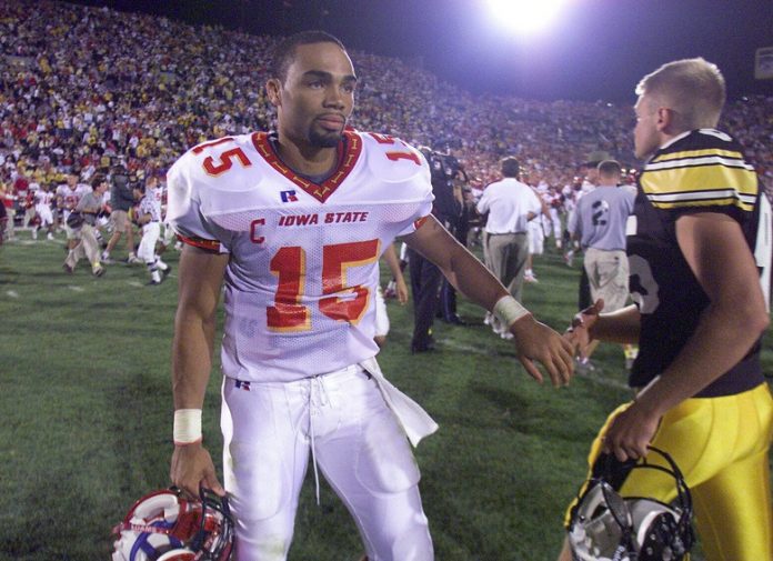 Iowa State quarterback Seneca Wallace, touching hands with Iowa kicker Nate Kaeding, completed a comeback Saturday against the Hawkeyes that came up short three weeks ago against Florida State.