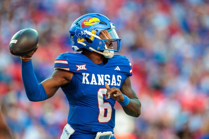 Kansas Jayhawks quarterback Jalon Daniels (6) passes the ball against the Houston Cougars during the third quarter at GEHA Field at Arrowhead Stadium.