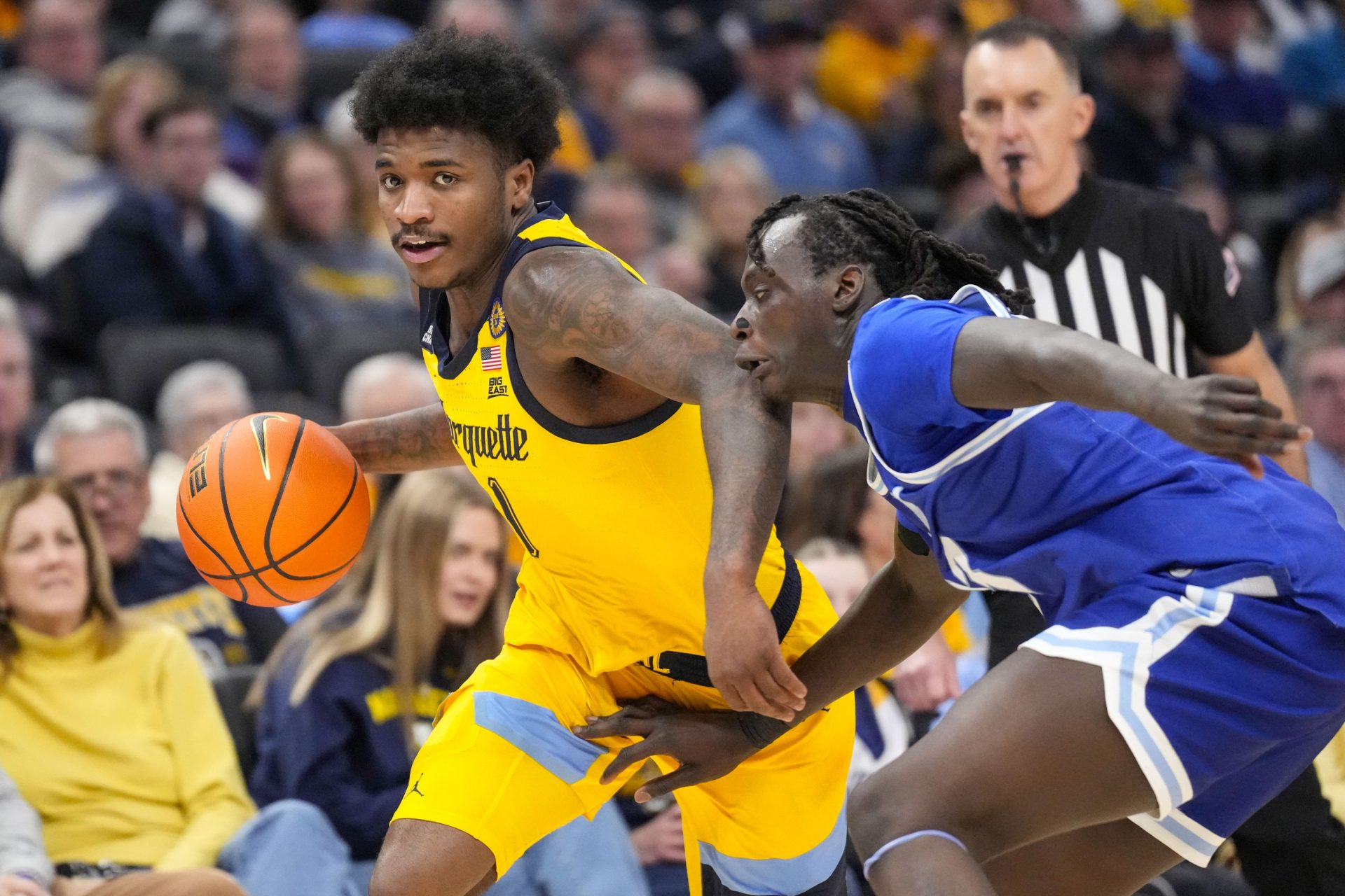 Marquette Golden Eagles guard Kam Jones (1) dribbles the ball under pressure from Seton Hall Pirates guard Garwey Dual (33) during the second at Fiserv Forum.