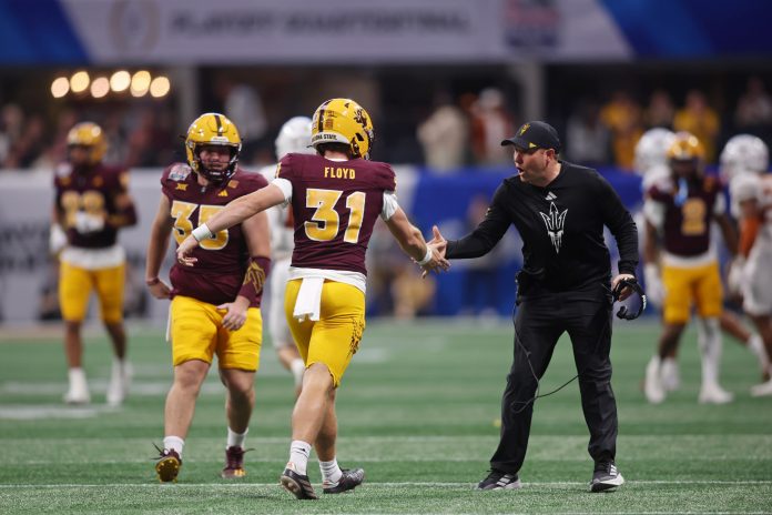 Arizona State Sun Devils punter Kanyon Floyd (31) high fives head coach Kenny Dillingham during the first half of the Peach Bowl at Mercedes-Benz Stadium.