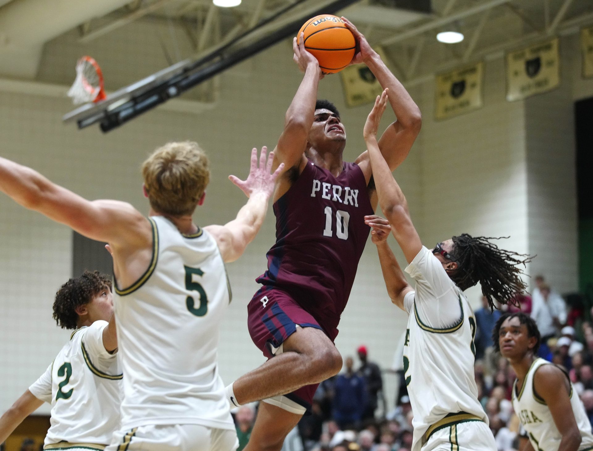 Perry forward Koa Peat (10) shoots against Basha during the a game at Basha High School.