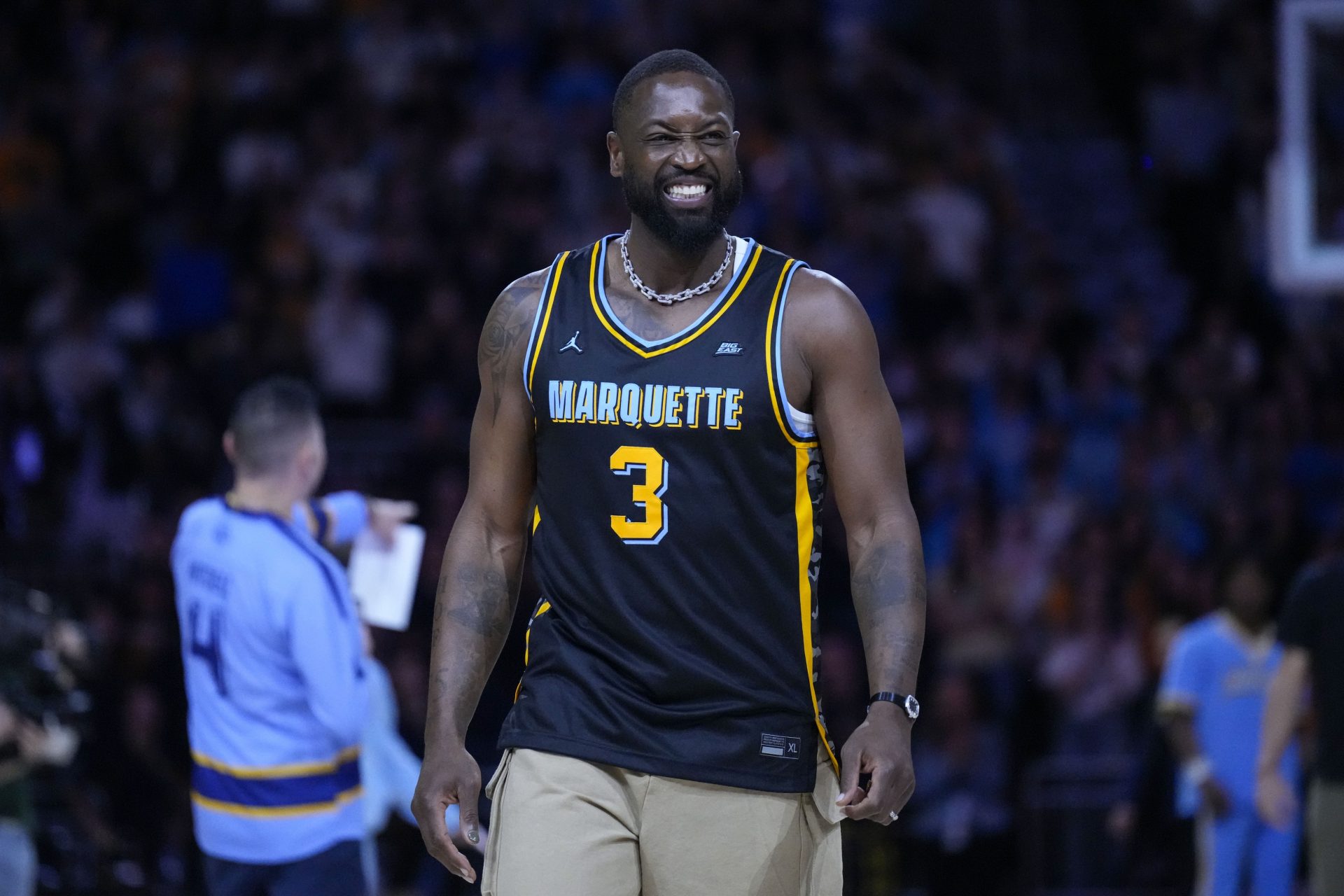 Former Marquette Golden Eagles player Dwyane Wade smiles timeout during the first half of the game against the Providence Friars at Fiserv Forum.