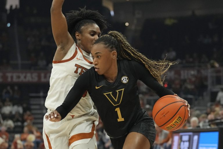 Vanderbilt Commodores guard Mikayla Blakes (1) drives to the basket against Texas Longhorns guard Rori Harmon (3) during the first half at Moody Center.