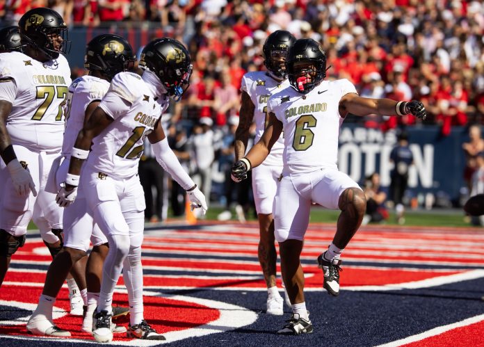 Colorado Buffaloes wide receiver Drelon Miller (6) celebrates after scoring a touchdown against the Arizona Wildcats in the first half at Arizona Stadium.