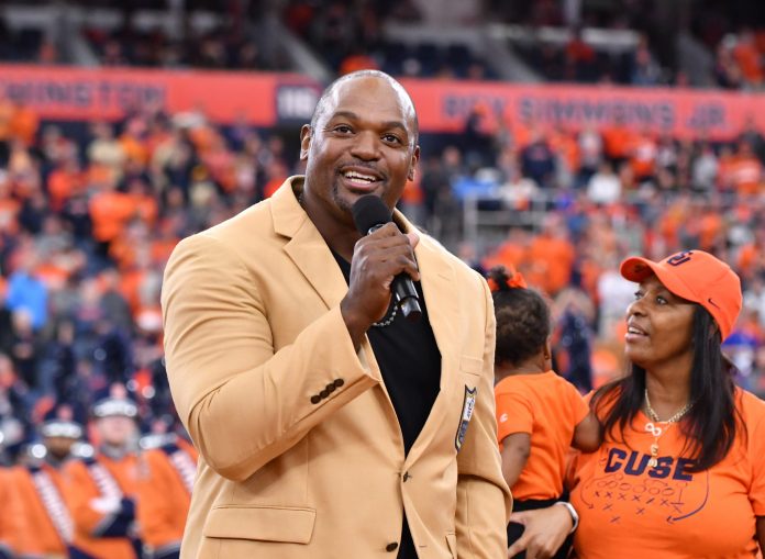 Former Syracuse Orange star and NFL Hall of Famer Dwight Freeney speaks during a ceremony to retire his jersey at the JMA Wireless Dome.