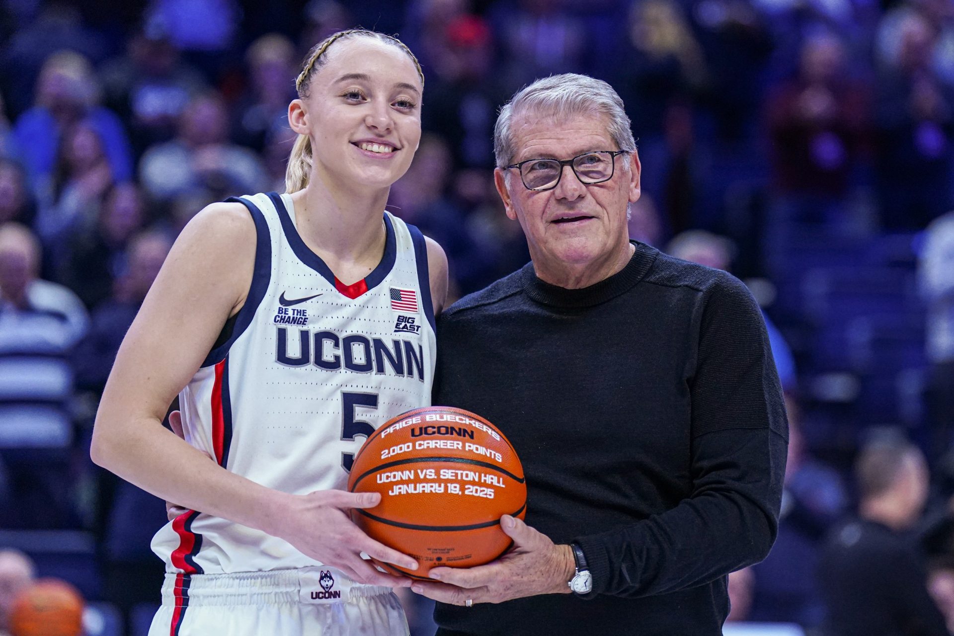 UConn Huskies guard Paige Bueckers (5) is recognized with head coach Geno Auriemma for her 2000 career points before the start of the game against the Villanova Wildcats at Harry A. Gampel Pavilion.