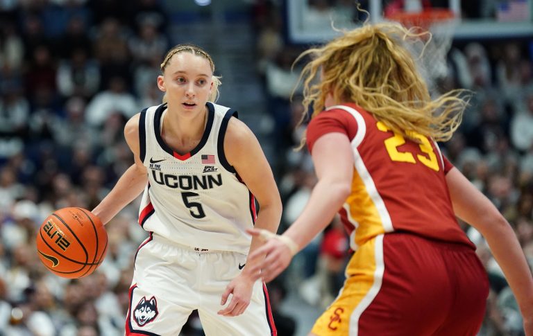UConn Huskies guard Paige Bueckers (5) moves the ball against USC Trojans guard Avery Howell (23) in the first half at XL Center.