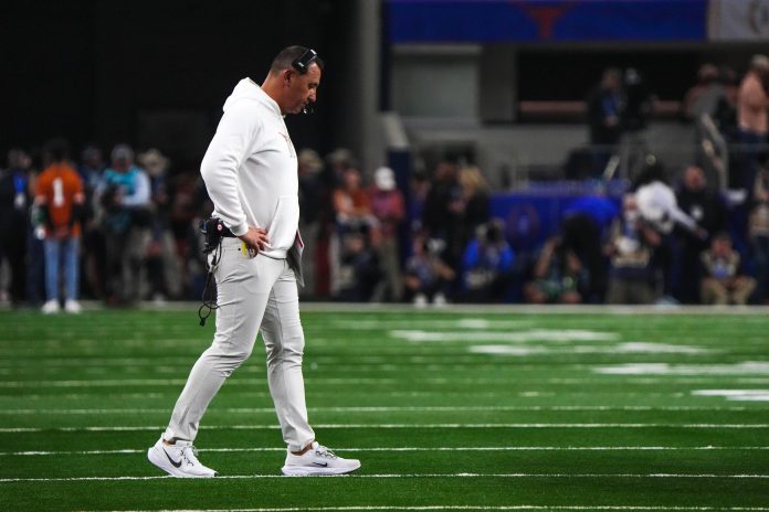 Texas Longhorns head coach Steve Sarkisian walks the field during the College Football Playoff semifinal game against Ohio State in the Cotton Bowl at AT&T Stadium on Friday, Jan. 10, 2024 in Arlington, Texas.