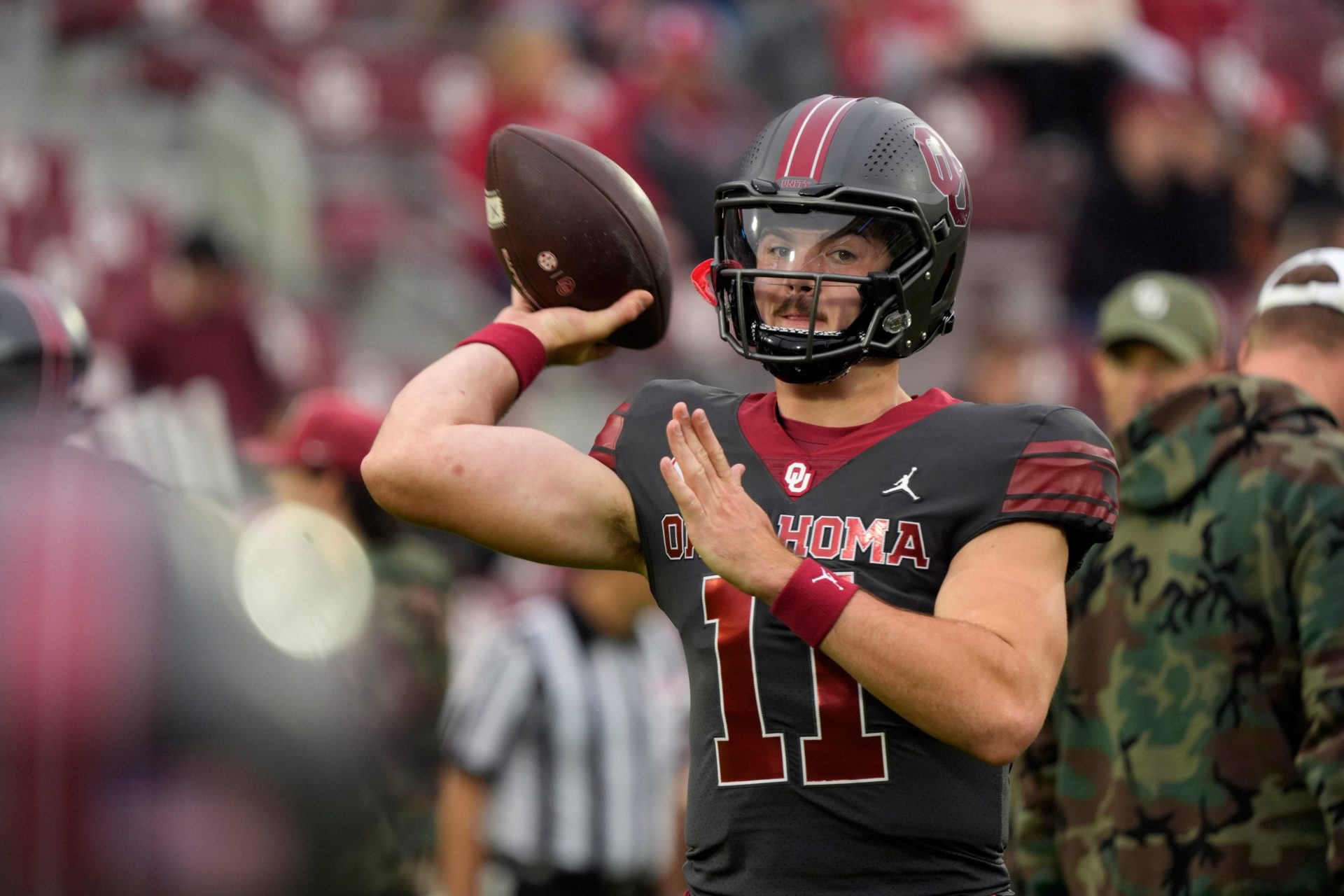 Oklahoma Sooners quarterback Jackson Arnold (11) warms up before a college football game between the University of Oklahoma Sooners (OU) and the Maine Black Bears at Gaylord Family - Oklahoma Memorial Stadium in Norman, Okla.