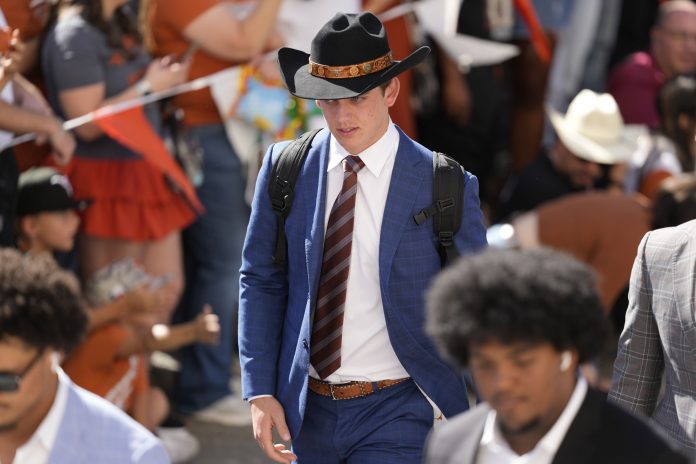 Texas Longhorns quarterback Arch Manning enters Darrell K Royal-Texas Memorial Stadium before a game against the Kentucky Wildcats.