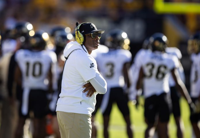 Colorado Buffaloes head coach Deion Sanders against the Arizona State Sun Devils at Mountain America Stadium.