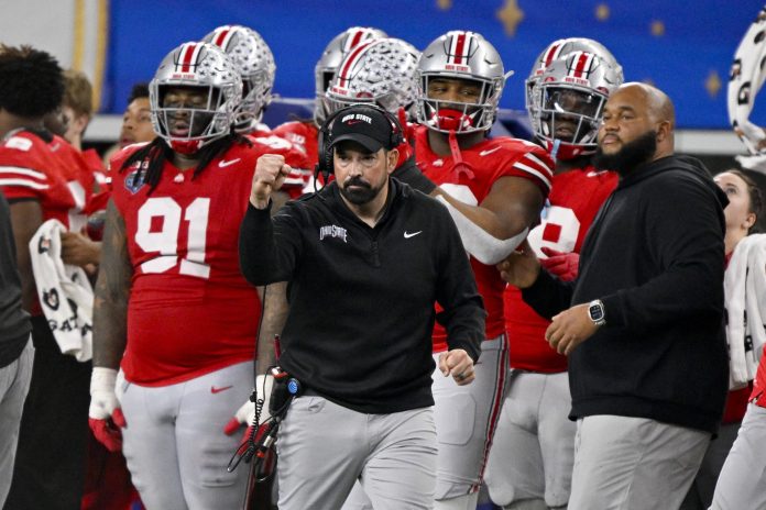 Ohio State Buckeyes head coach Ryan Day celebrates during the game against the Texas Longhorns at AT&T Stadium.