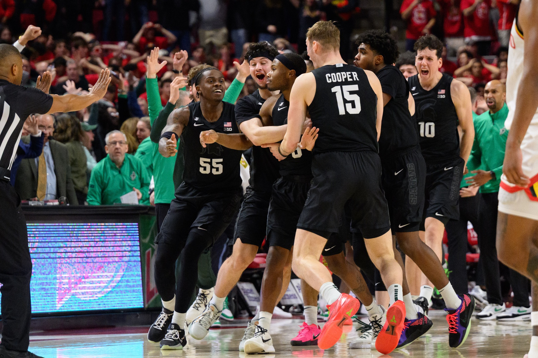 Michigan State Spartans guard Tre Holloman (5) celebrates with teammates after hitting a shot at the buzzer during the second half against the Maryland Terrapins at Xfinity Center.