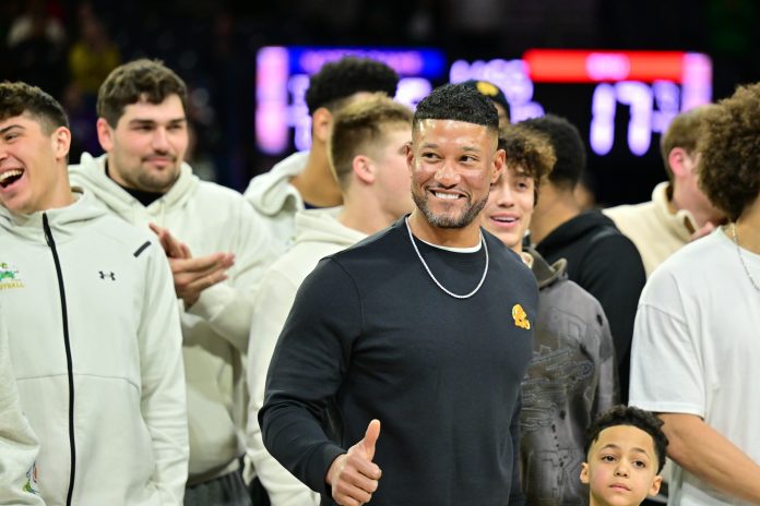 Notre Dame head football coach Marcus Freeman and team are honored in the first half of the game between the Notre Dame Fighting Irish and the SMU Mustangs at the Purcell Pavilion.