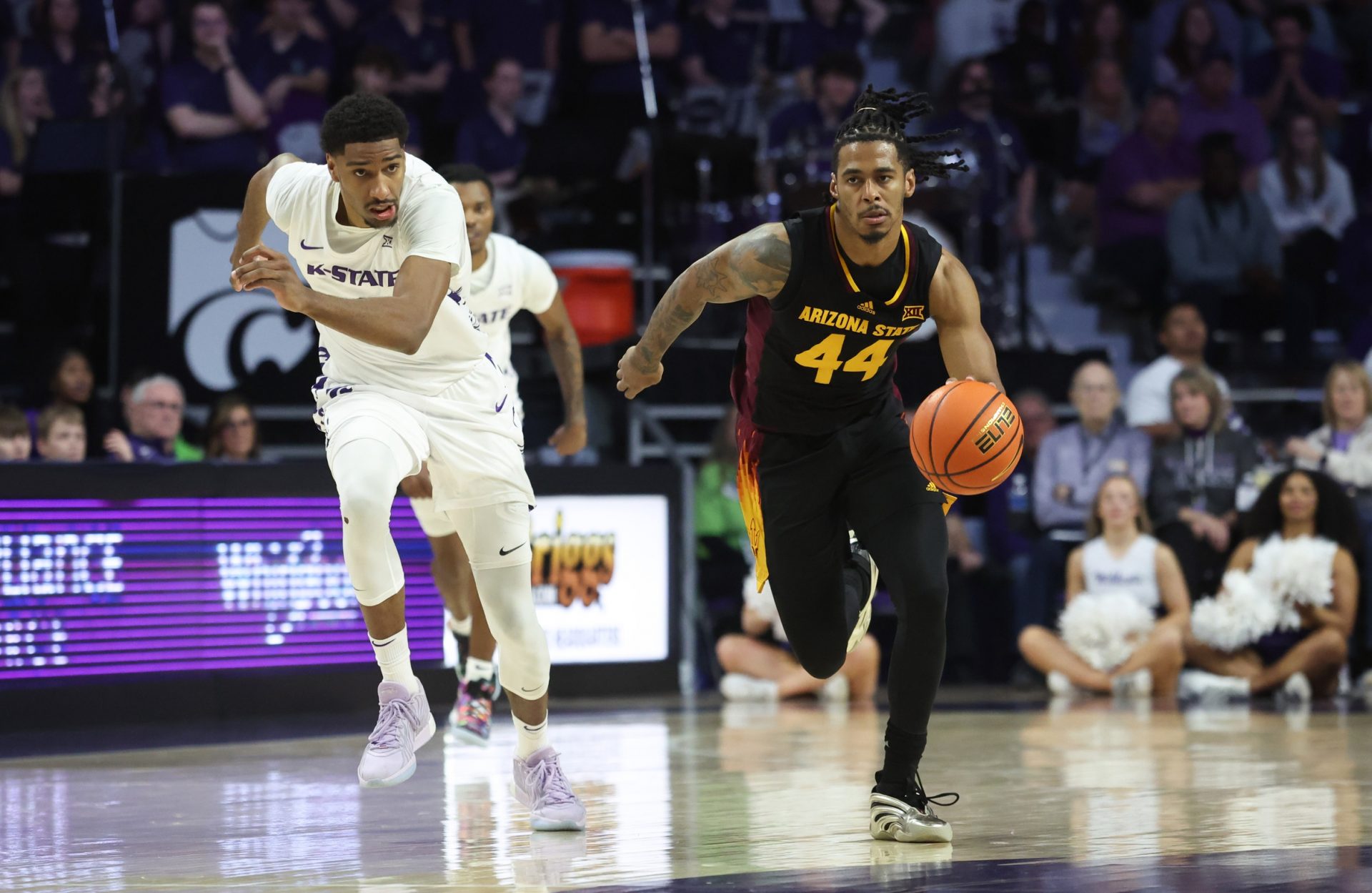 Arizona State Sun Devils guard Adam Miller (44) brings the ball up court against Kansas State Wildcats forward David N'Guessan (1) during the first half at Bramlage Coliseum.