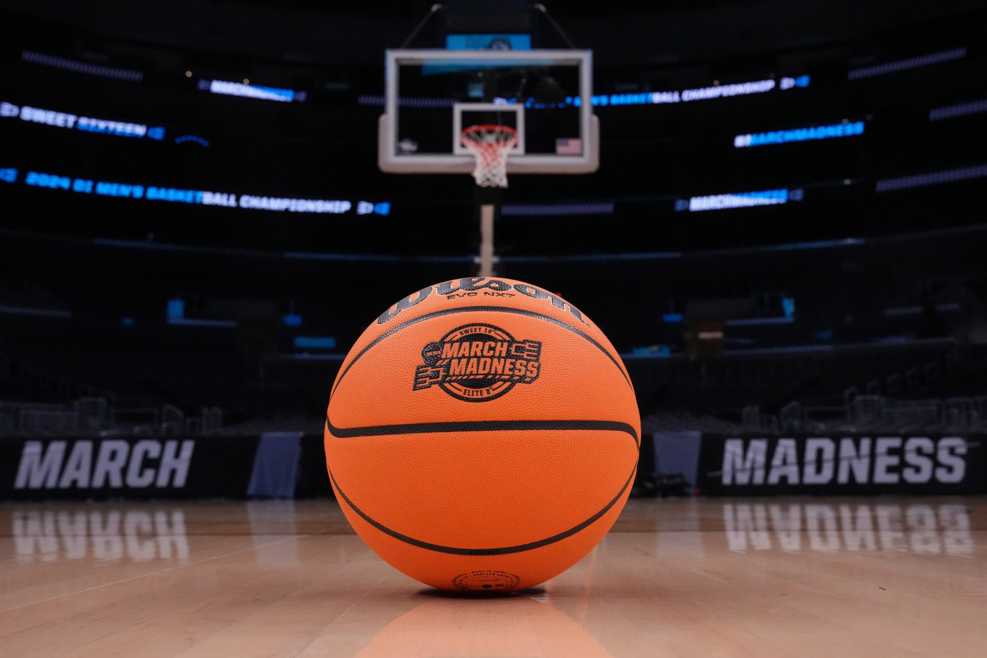 A Wilson official Evo NXT game basketball with March Madness and Elite 8 and Sweet logo at Crypto.com Arena.