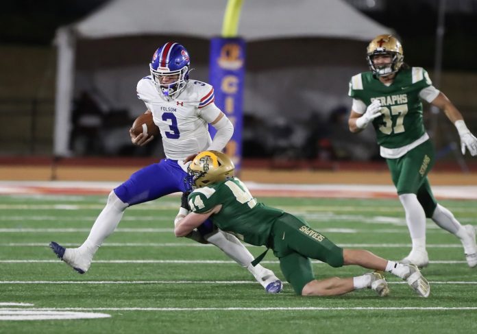 St. Bonaventure's Dylan Dunst tackles Folsom quarterback Ryder Lyons during the fourth quarter of the CIF-State Division 1-A state championship bowl at Saddleback College in Mission Viejo on Saturday, Dec. 9, 2023. St. Bonaventure lost 20-14.