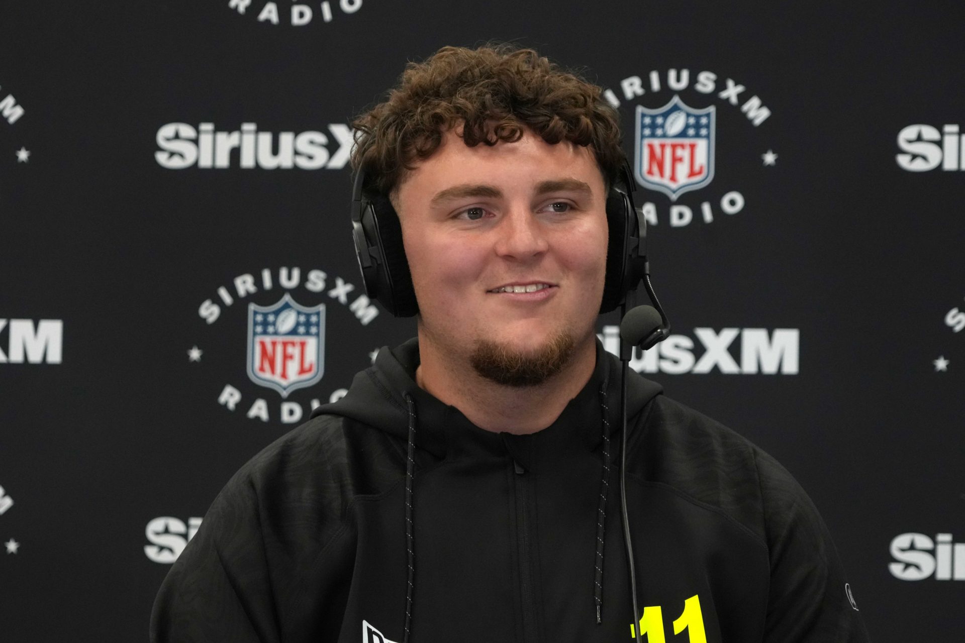 Michigan defensive lineman Mason Graham (DL11) on the SiriusXM radio set during the 2025 NFL Scouting Combine at the Indiana Convention Center.