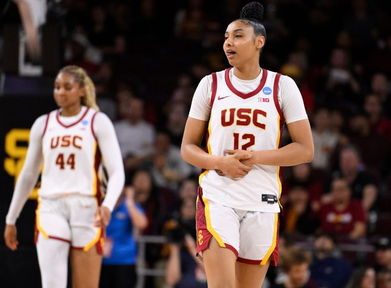 USC Trojans guard JuJu Watkins (12) grimaces and hold her wrist during the second quarter of an NCAA Tournament game against the UNC Greensboro Spartans at Galen Center.