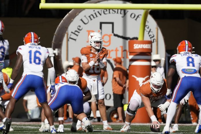 Texas Longhorns quarterback Arch Manning (16) prepares to hike the ball during the second half against the Florida Gators at Darrell K Royal-Texas Memorial Stadium.