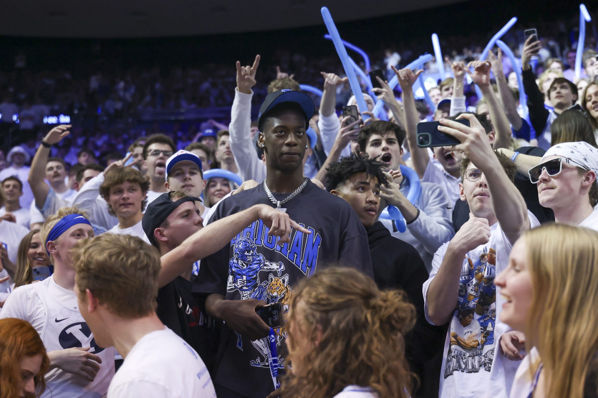 Brigham Young Cougars 2025/-2026 top recruit Aj Dybantsa joins the student section during the second half of the game against the West Virginia Mountaineers at Marriott Center.