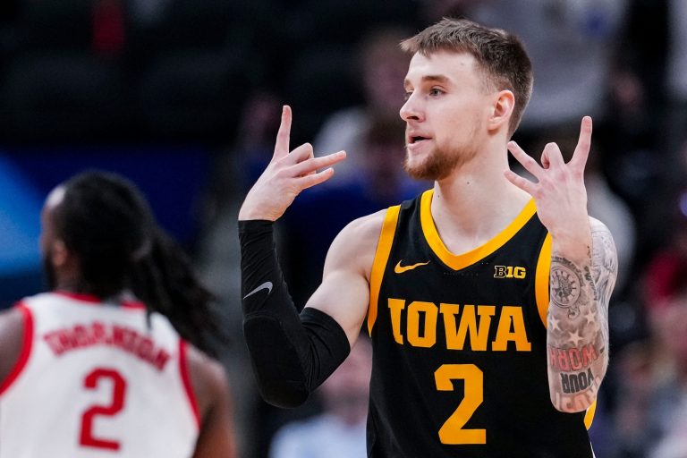Iowa Hawkeyes guard Brock Harding (2) celebrates scoring a 3-pointer Wednesday, March 12, 2025, in a first round game at the 2025 TIAA Big Ten Men’s Basketball Tournament between the Iowa Hawkeyes and the Ohio State Buckeyes at Gainbridge Fieldhouse in Indianapolis.
