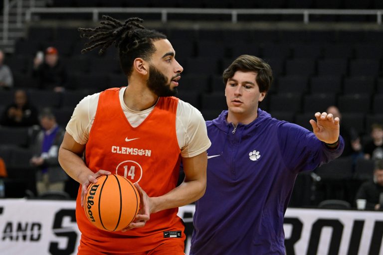 Clemson Tigers center Christian Reeves (14) works with a coaching assistant at a practice at Amica Mutual Pavilion.
