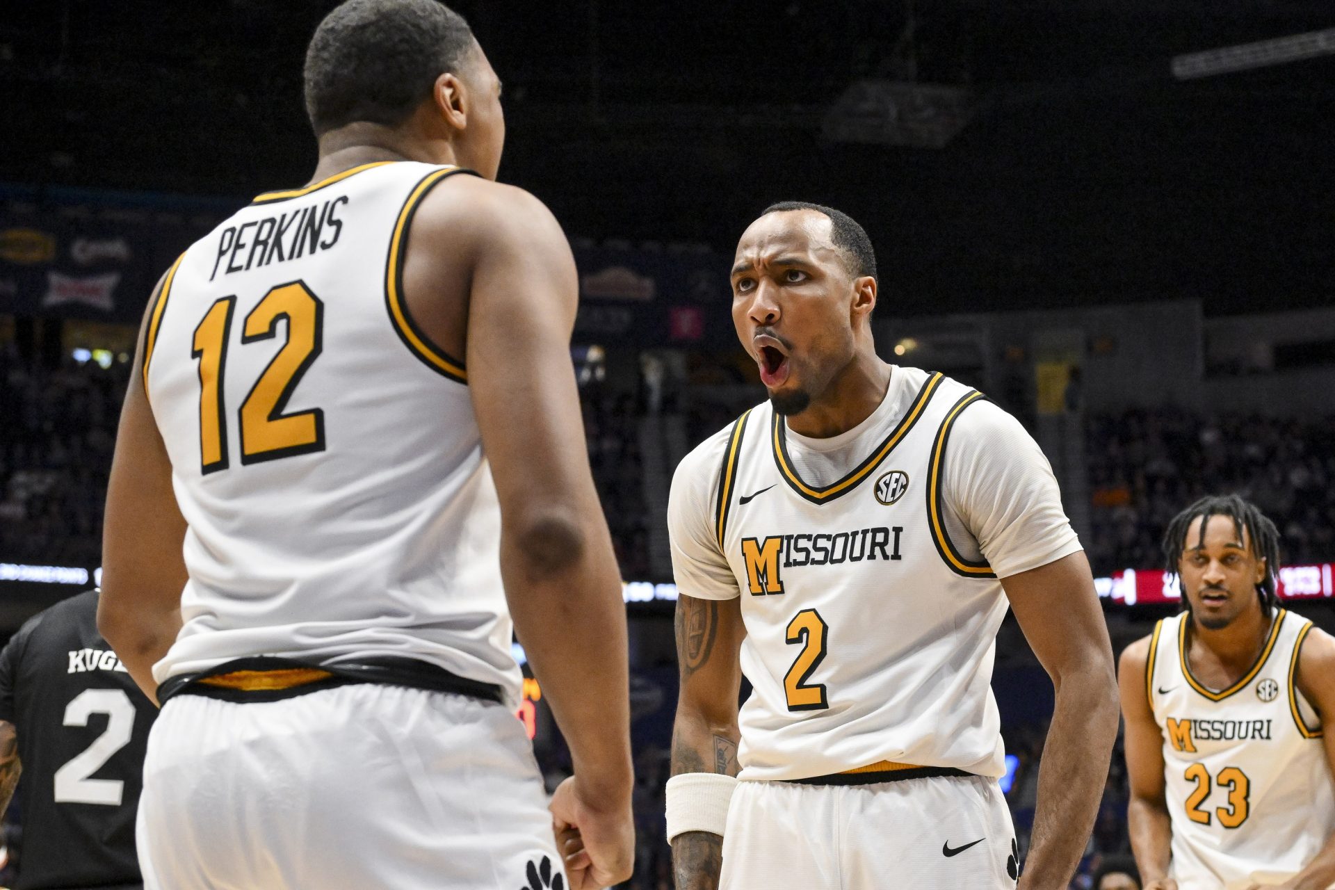 Missouri Tigers guard Tamar Bates (2) celebrates the foul with guard Tony Perkins (12) against the Mississippi State Bulldogs during the second half at Bridgestone Arena.