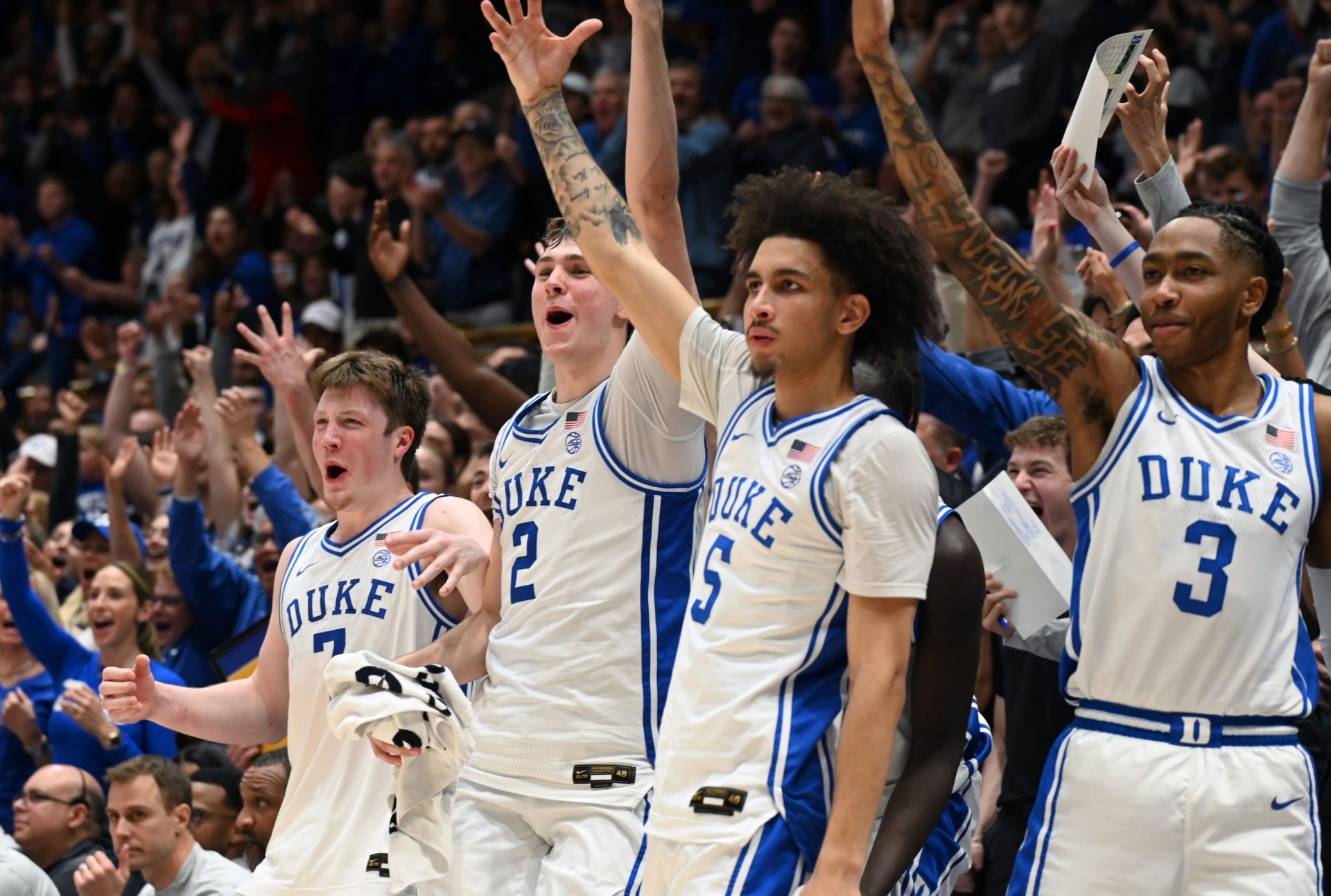 Duke Blue Devils forward Kon Knueppel (7) forward Cooper Flagg (2) guard Tyrese Proctor (5) and forward Isaiah Evans (3) react during the second half against the Wake Forest Demon Deacons at Cameron Indoor Stadium. The Blue Devils won 93-60.