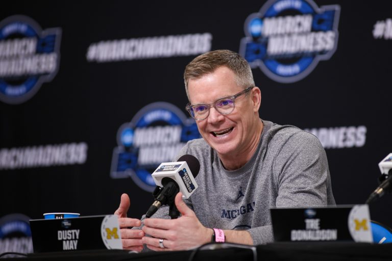 Michigan Wolverines head coach Dusty May addresses the media in a press conference during NCAA Tournament South Regional Practice at State Farm Arena.